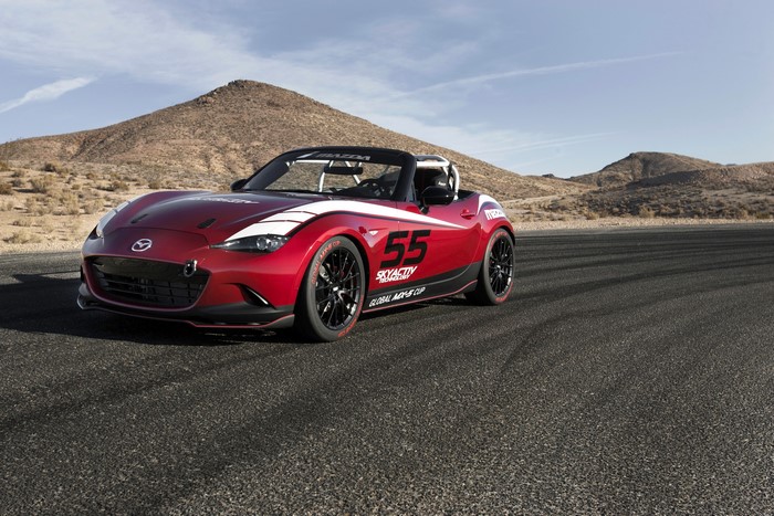 Red 2016 Mazda MX-5 Cup racecar on asphalt