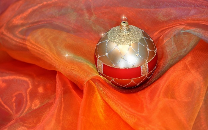 Christmas ornament on orange fabric