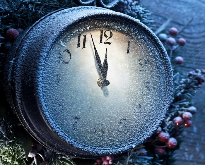 Christmas clock covered in snow