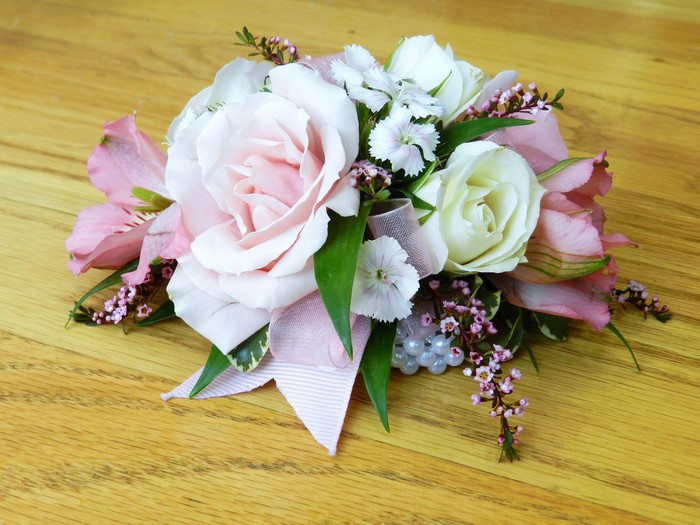 Pink and white rose corsage with alstroemeria and carnations