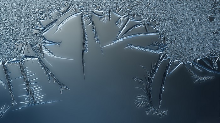 Close-up of frost patterns on glass
