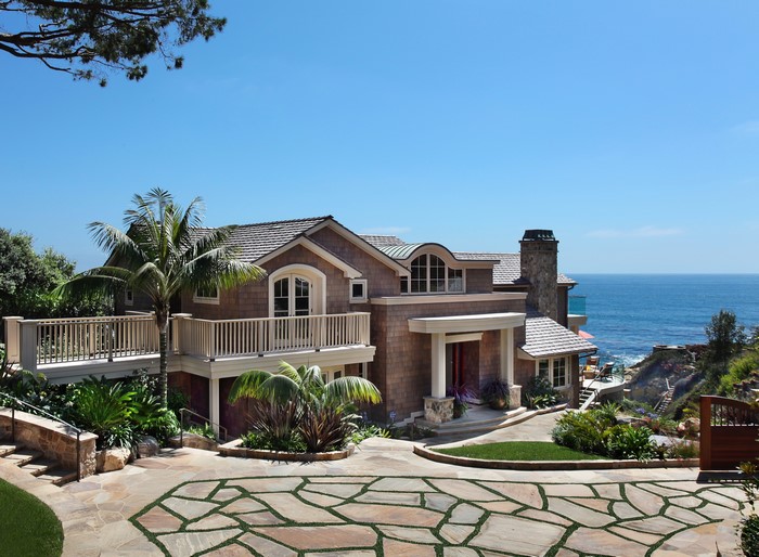 Luxury coastal home with ocean view and stone driveway