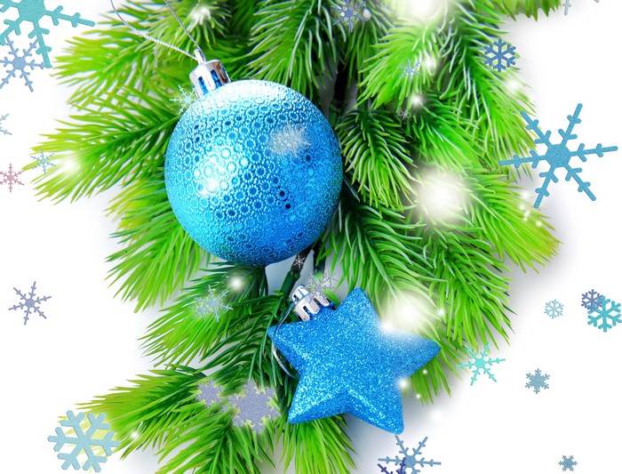 Christmas ornaments on pine branches with snowflakes