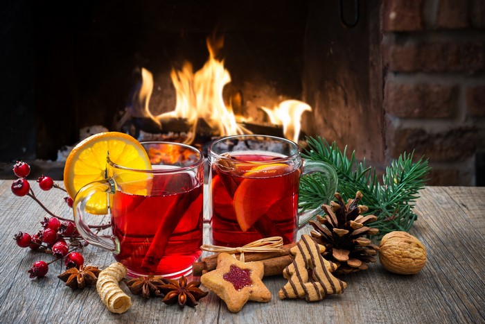 Mulled wine by the fireplace with Christmas cookies