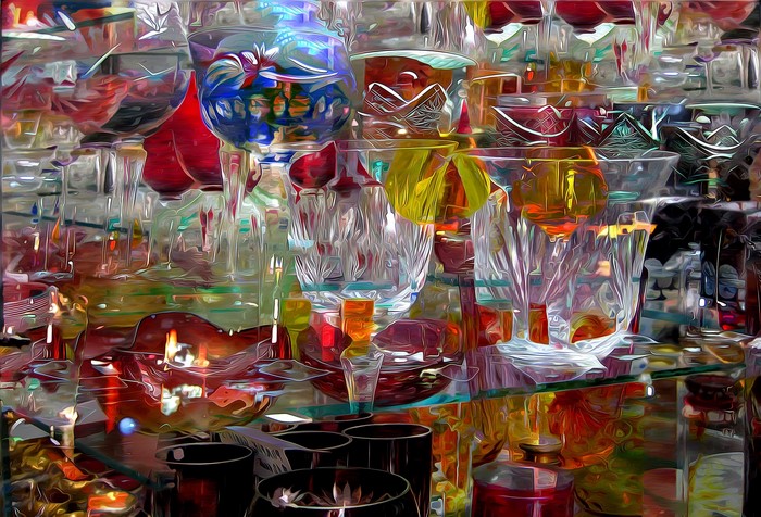 Assortment of colorful glassware and candle