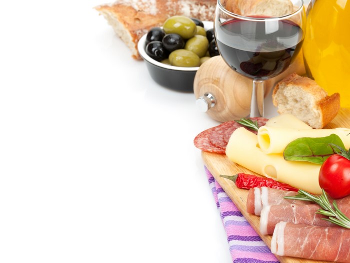 Still-life with wine, ham, cheese, and olives
