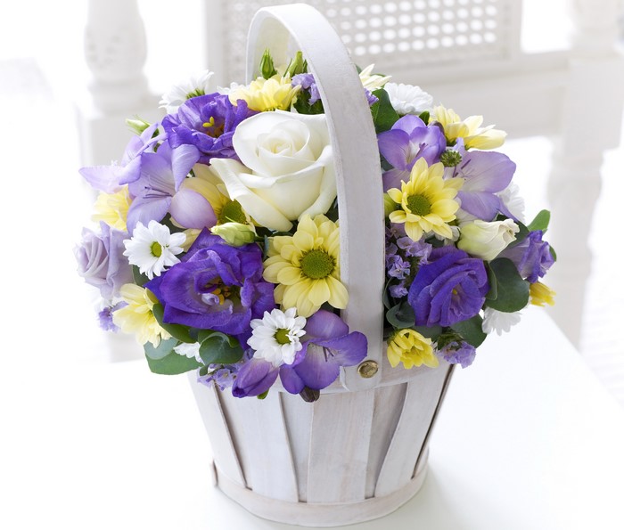 Bouquet of Roses, Eustoma, Freesia, and Chrysanthemums in a Wicker Basket