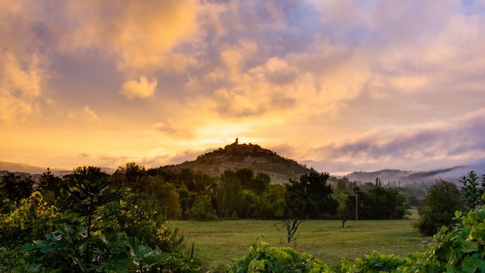 Village on a hill at sunrise, Midi-Pyrenees, France