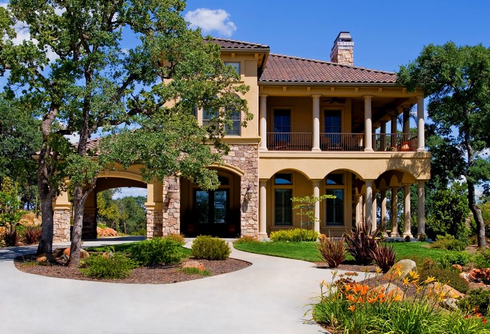 Luxury Mediterranean-style house with landscaping