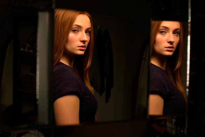 Sophie Turner in a dark room