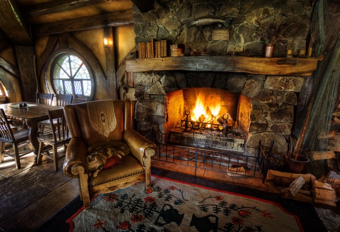Cozy Hobbit Hole Interior with Fireplace and Armchair