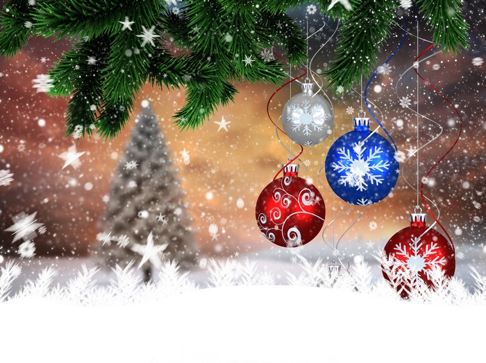 Christmas tree branches with ornaments and snow