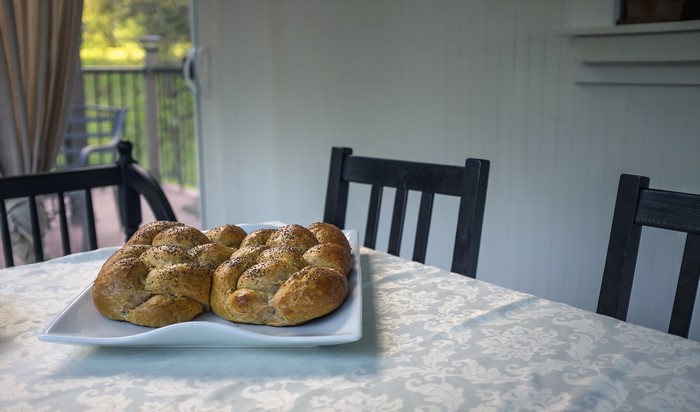 Two challah breads on a table