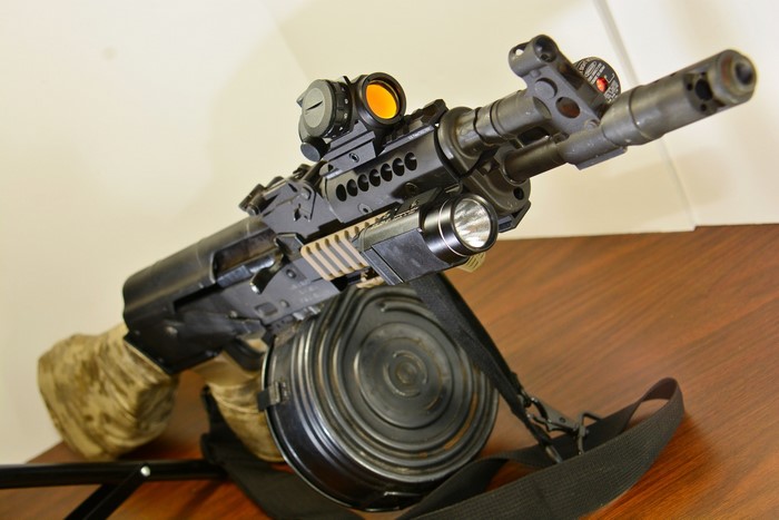 Draco AK assault rifle with drum magazine and accessories