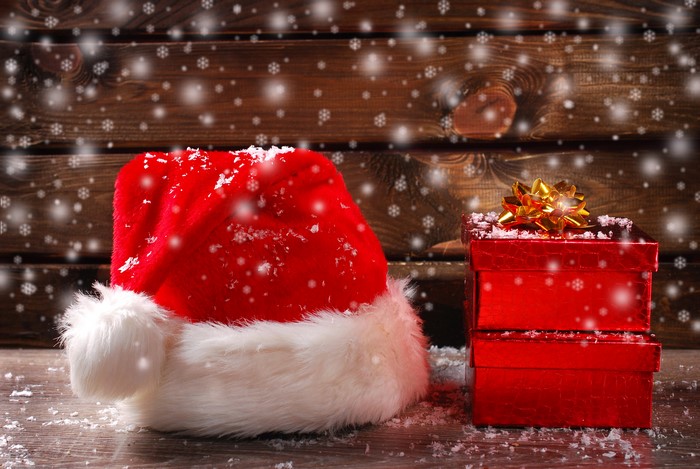 Christmas Santa hat and gifts with snowflakes