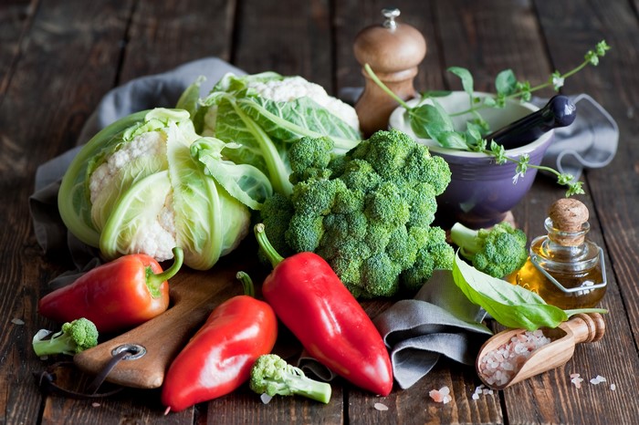 Fresh vegetables including cauliflower, broccoli, and bell peppers
