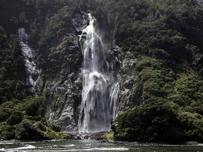 Waterfall in Fiordland National Park, New Zealand