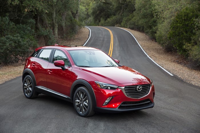 Red 2015 Mazda CX-3 on a Winding Road