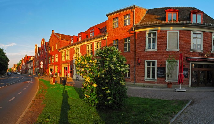 Street with red brick buildings in Potsdam, Germany