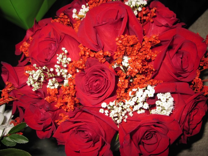 Bouquet of red roses with small flowers
