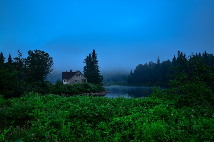 House by the lake in Jacques-Cartier Park, Canada