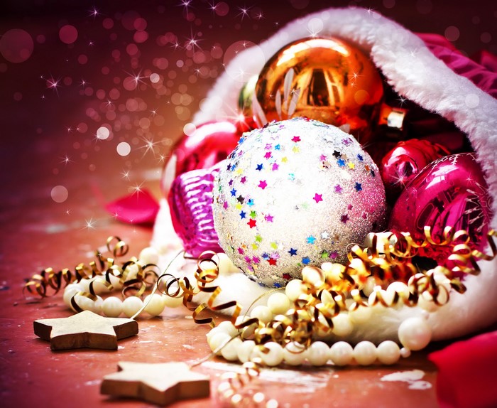 Christmas ornaments spilling out of Santa's hat