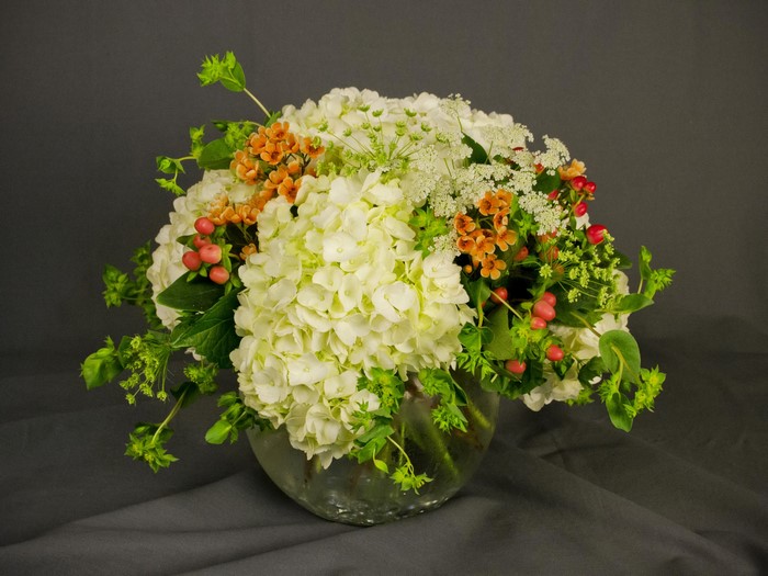 White Hydrangea and Orange Flower Bouquet in Glass Vase