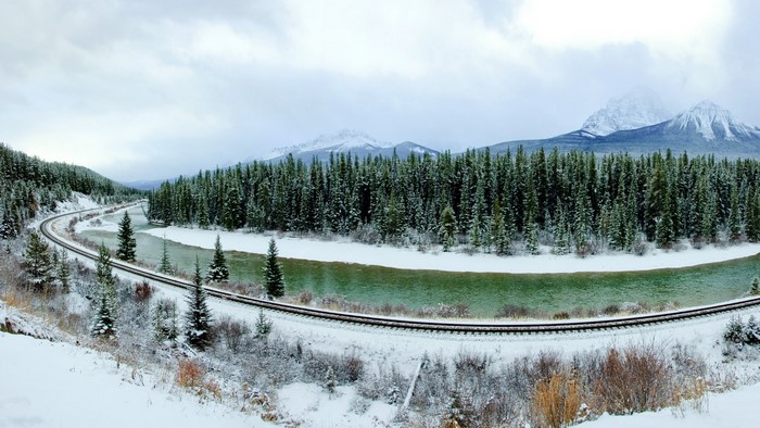 Winter Train Tracks Along a River in Banff National Park, Canada