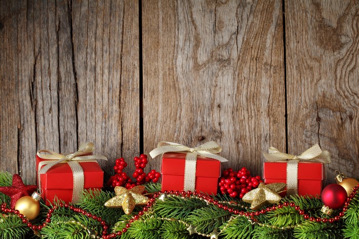 Christmas Gifts and Decorations on Wooden Background