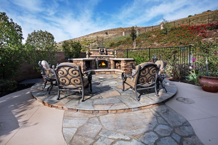 Outdoor Living Area with Fireplace and Chairs
