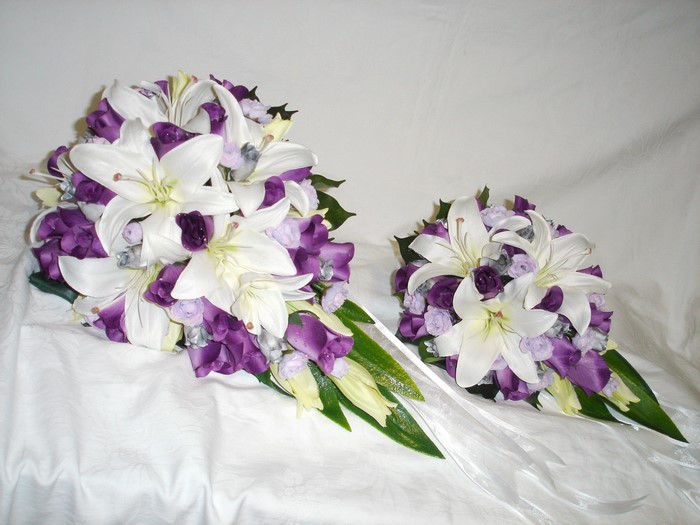 Two bouquets of white lilies and purple flowers