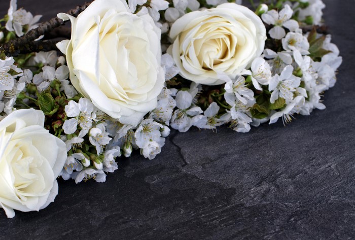 Three white roses with cherry blossoms