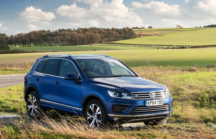 Blue 2014 Volkswagen Touareg R-Line in a field
