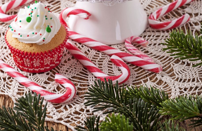 Christmas cupcake with candy canes and pine branches