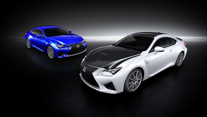 Two Lexus RC F cars, one blue and one white with black hood