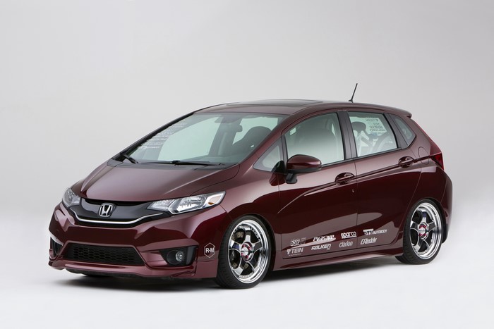 Honda Fit with racing decals and custom wheels