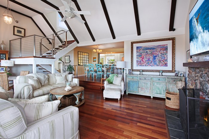 Living room with stairs and dining area