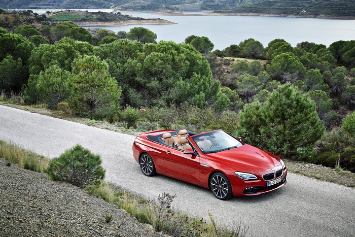 Red BMW M6 Convertible on a scenic road