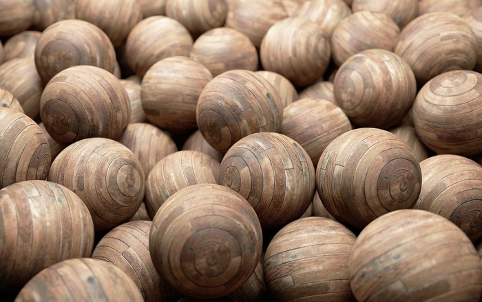 Many wooden balls piled together