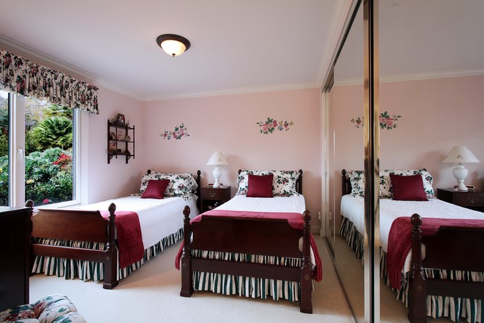 Bedroom with two beds and floral decor