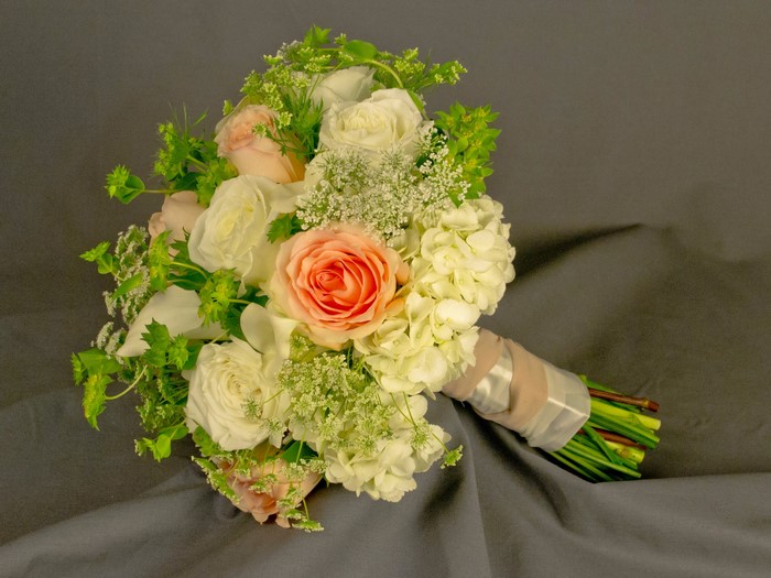 Wedding bouquet with roses, callas, and hydrangea