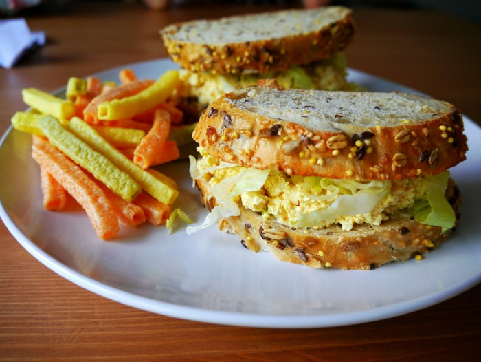 Egg salad sandwich with cheese puffs