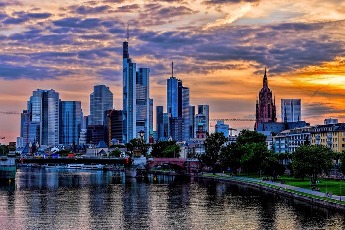 Frankfurt skyline with river and sunset
