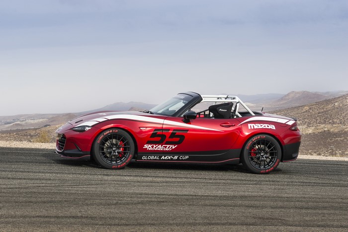 Red Mazda MX-5 Cup racecar with number 55