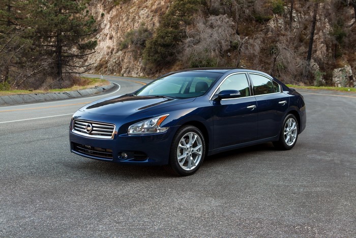 Blue 2014 Nissan Maxima on a Winding Road