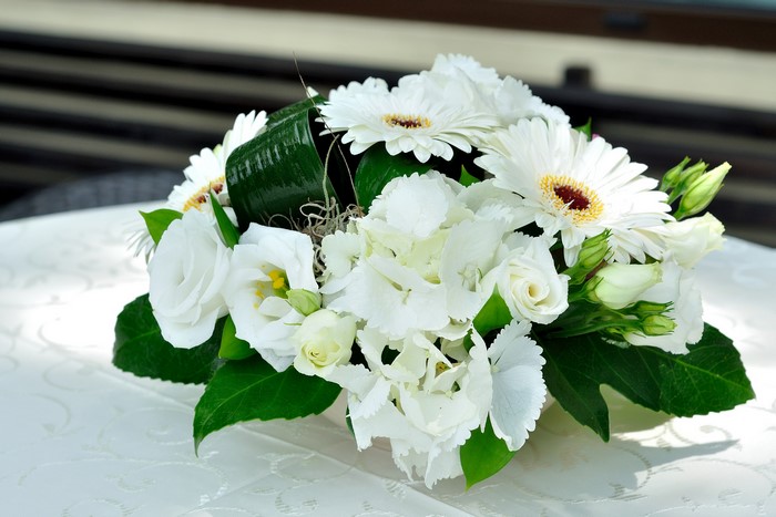 White floral arrangement with gerberas and roses