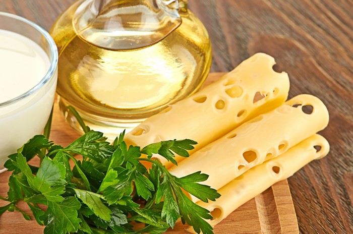 Cheese slices, oil, milk, and parsley