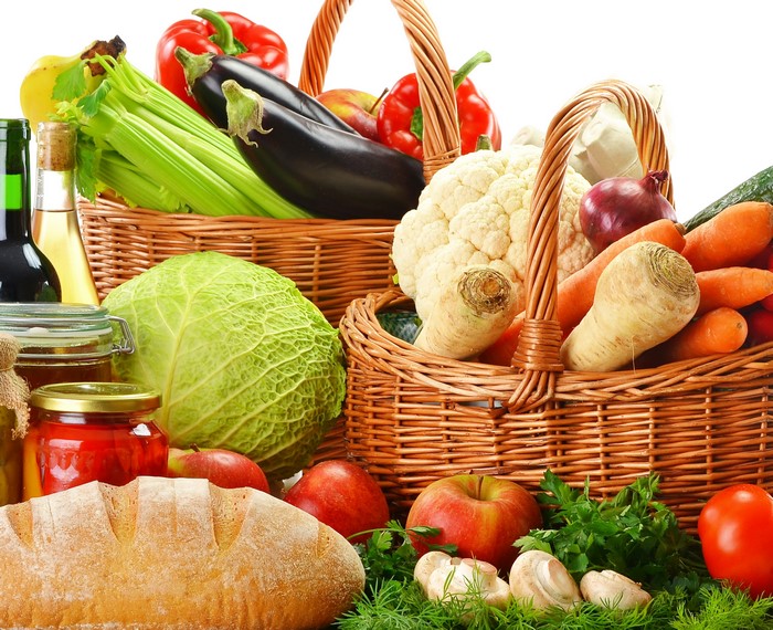 Vegetables and Bread in Wicker Baskets