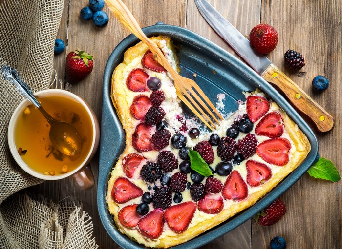Heart-shaped berry pastry with tea