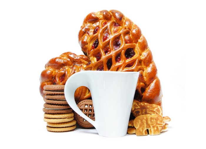 Pastries, cookies, and a cup